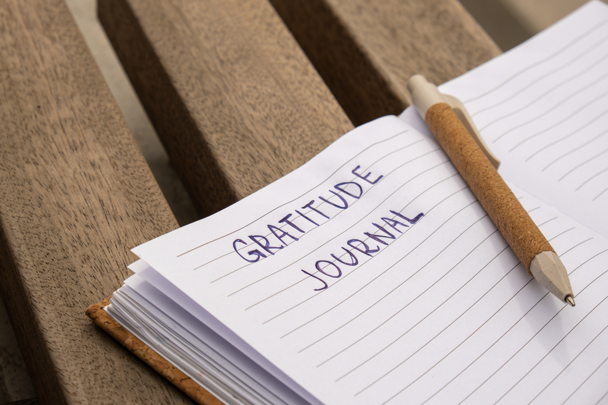 Writing Gratitude Journal on Wooden Bench. Today I Am Grateful for. Self Discovery Journal, Self Reflection Creative Writing, Self Growth Personal Development Concept. Wellbeing Spiritual Health, Being Mindful, Holistic Health Practices